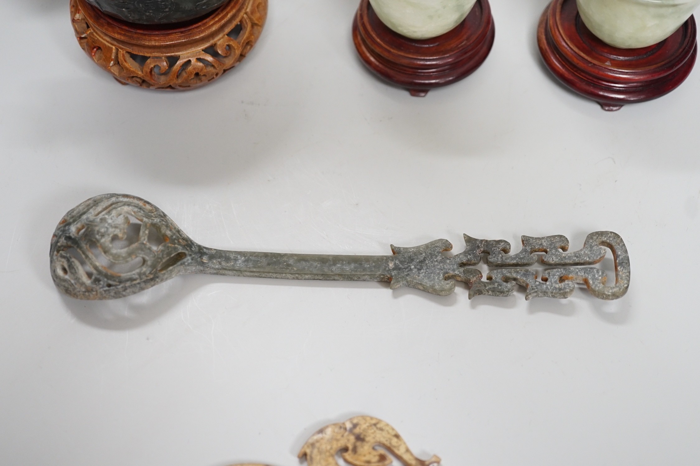 A selection of five Chinese archaistic hardstone carvings. Tallest 8cm including stand